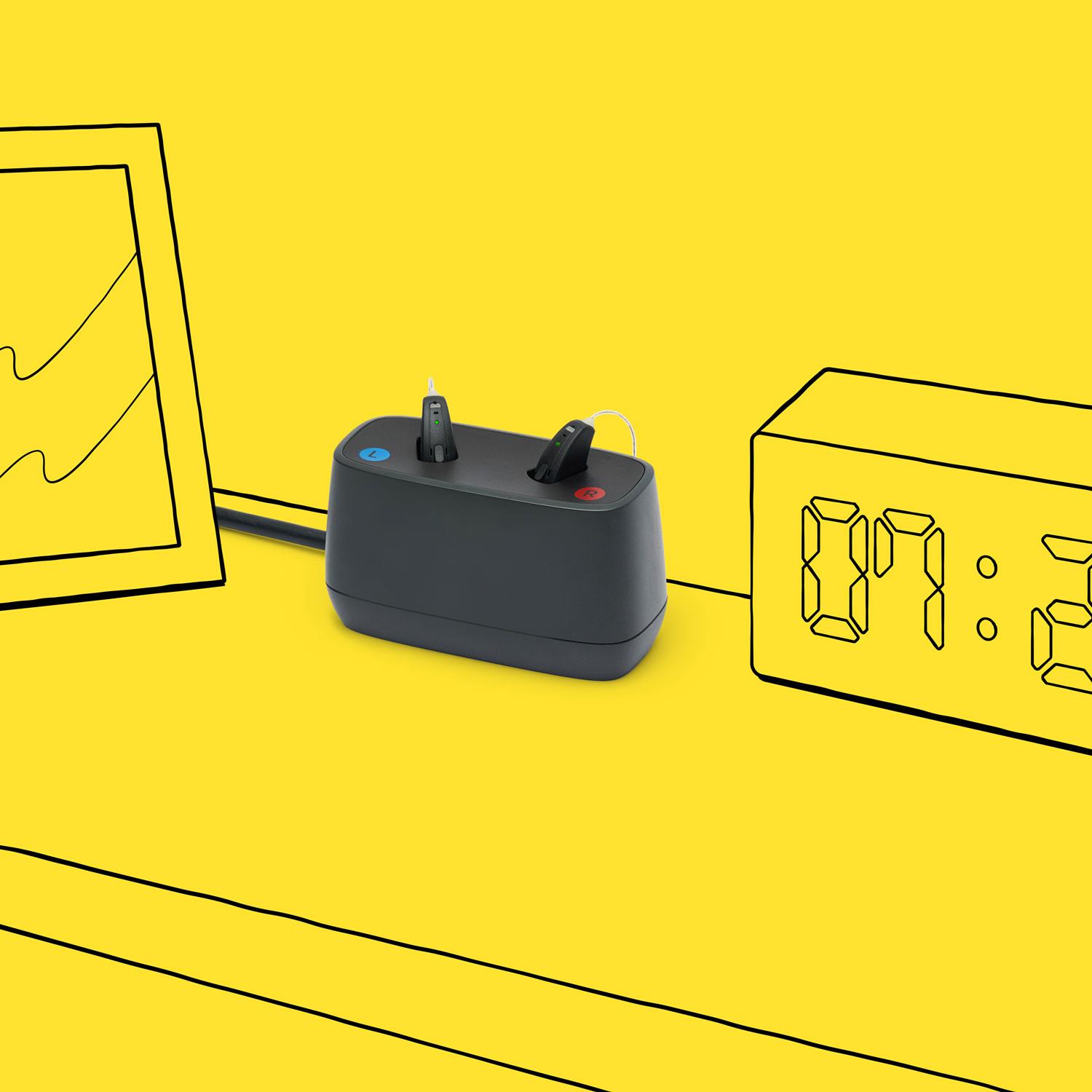 Interton Move rechargeable hearing aids and the desktop charger.