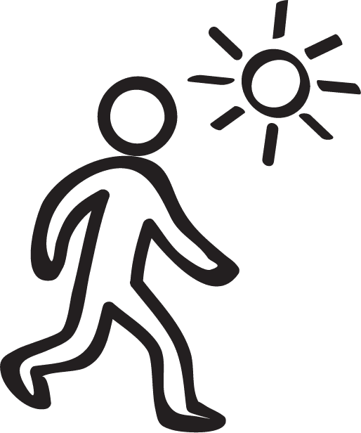 Happy man walking in sunshine with Interton hearing aids.