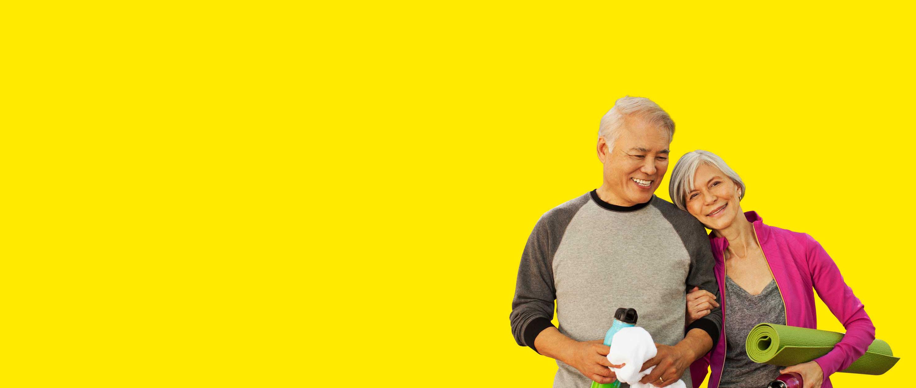 Asian couple wearing Interton affordable hearing aids. 