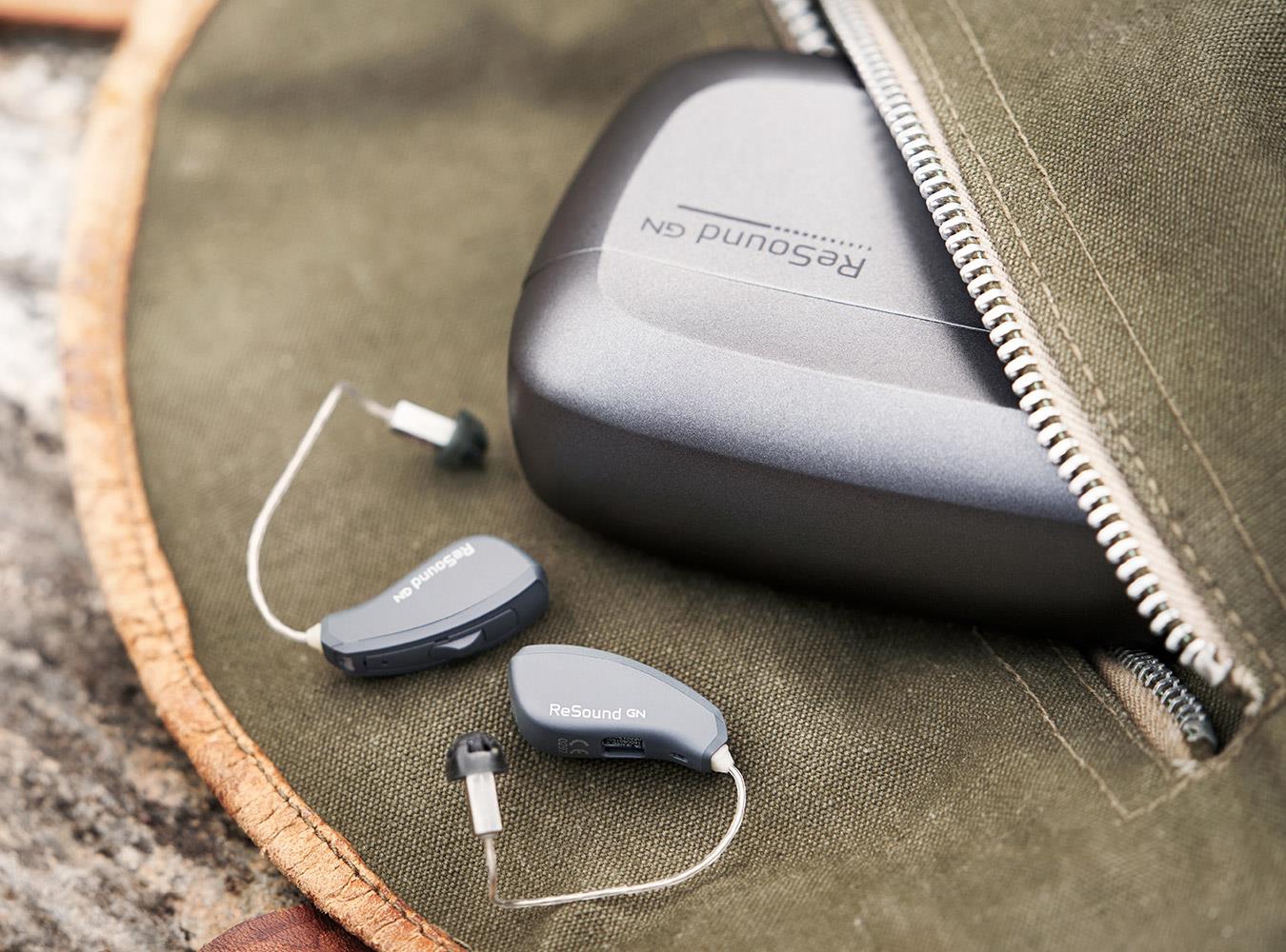 Pocked-sized ReSound LiNX Quattro and charger.